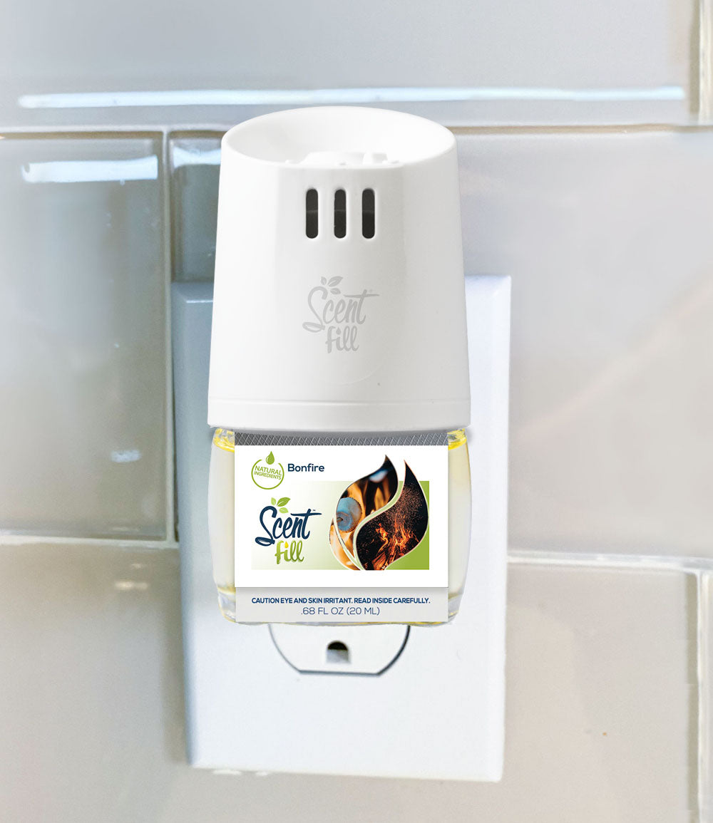 Natural Plug In Refill bottle plugged into a warmer and outlet Bonfire