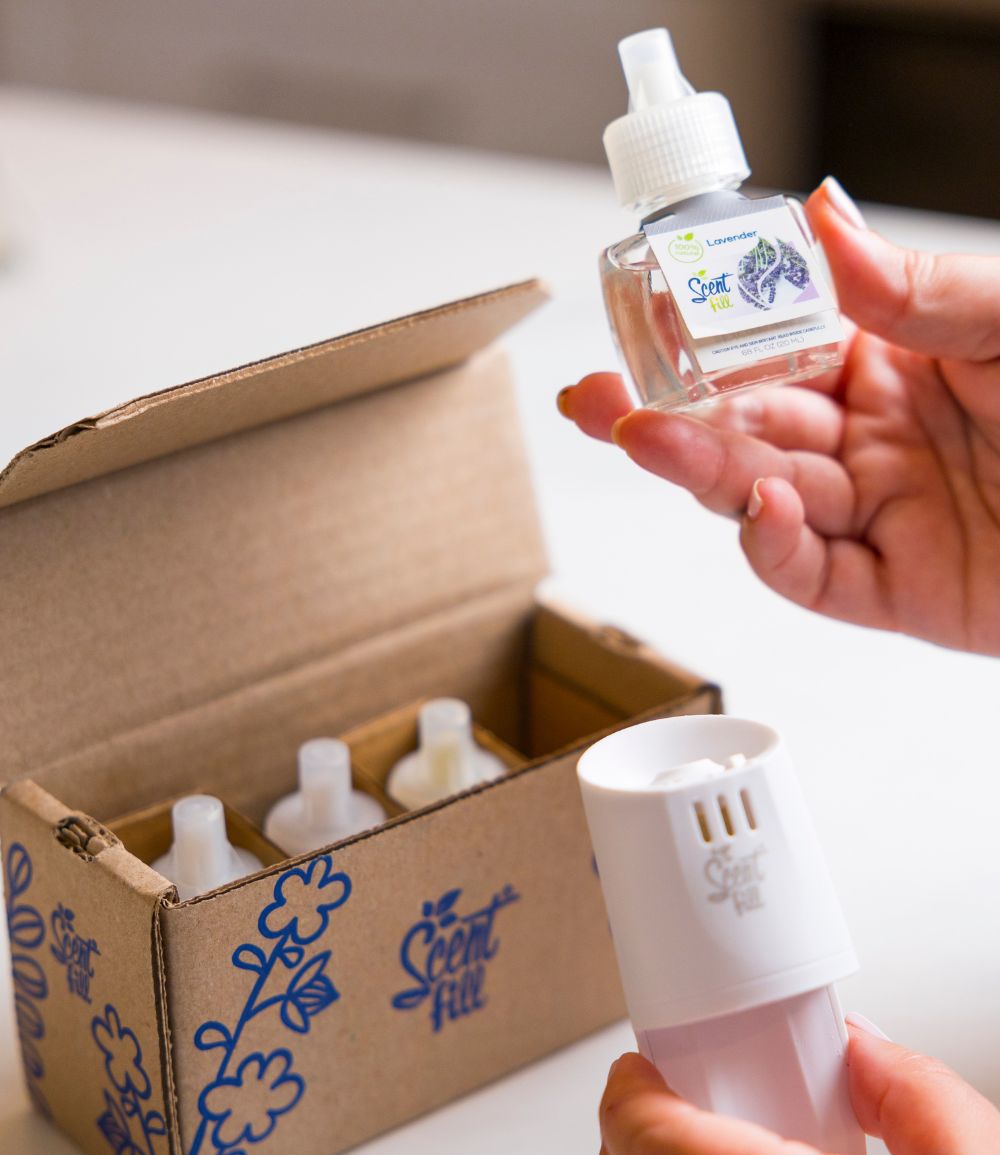 Scent Fill Spring Starter Kit 100% Natural plug in air fresheners woman unboxing in kitchen