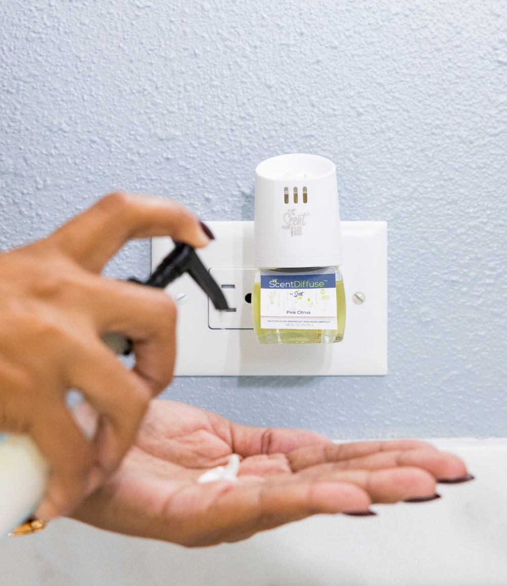 Scent Fill's ScentDiffuse natural deodorizing plug in refill plugged into bathroom to refresh