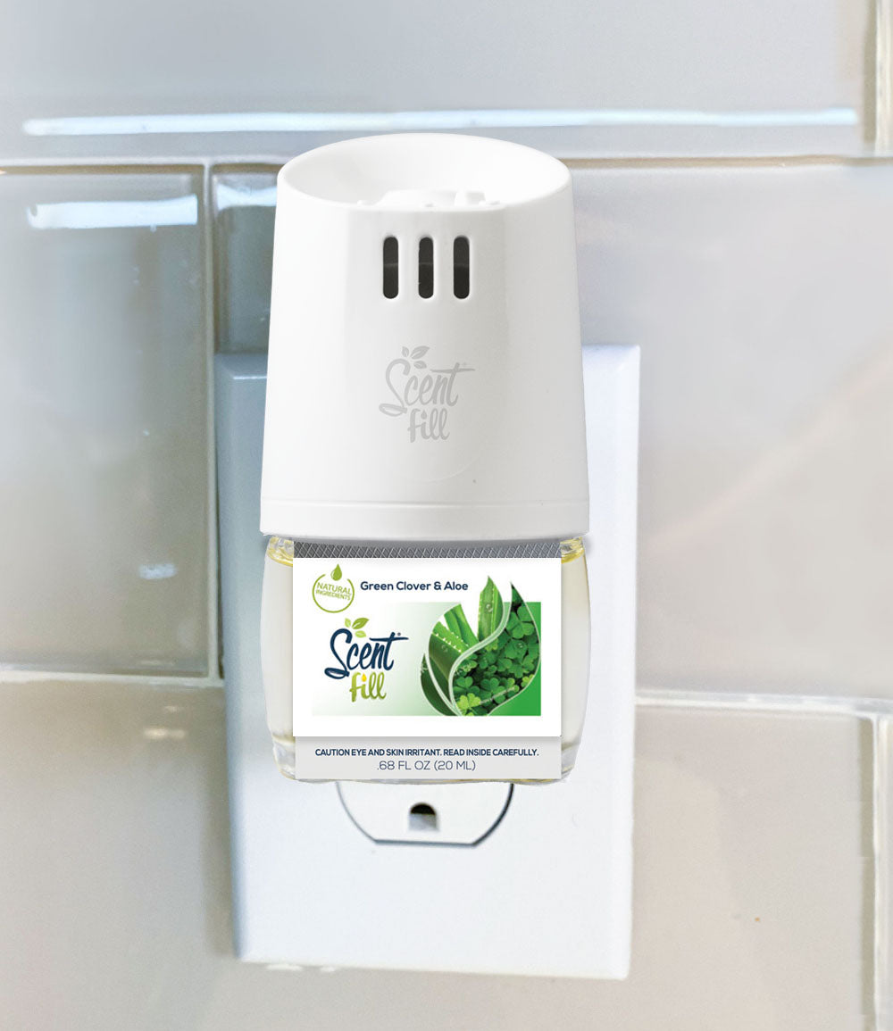Natural Green clover and aloe plug in refill plugged into wall warmer