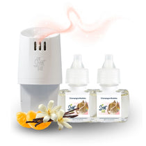 Scent Fill plug-in diffuser with two Champagne Bubbles refill bottles displayed beside orange slices, white blossoms, and vanilla beans, with a soft sparkling scent trail rising above.