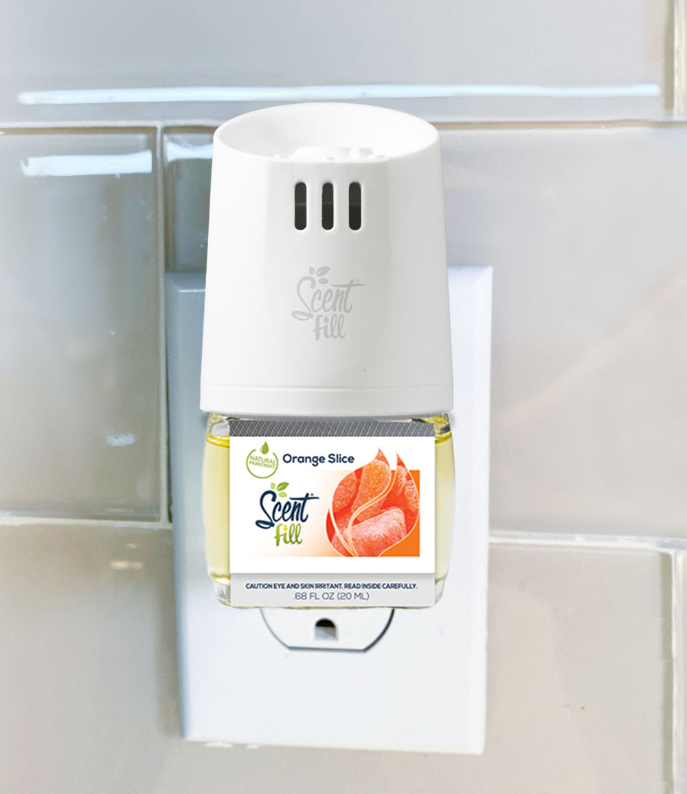 Orange Slice air freshener plugged into diffuser