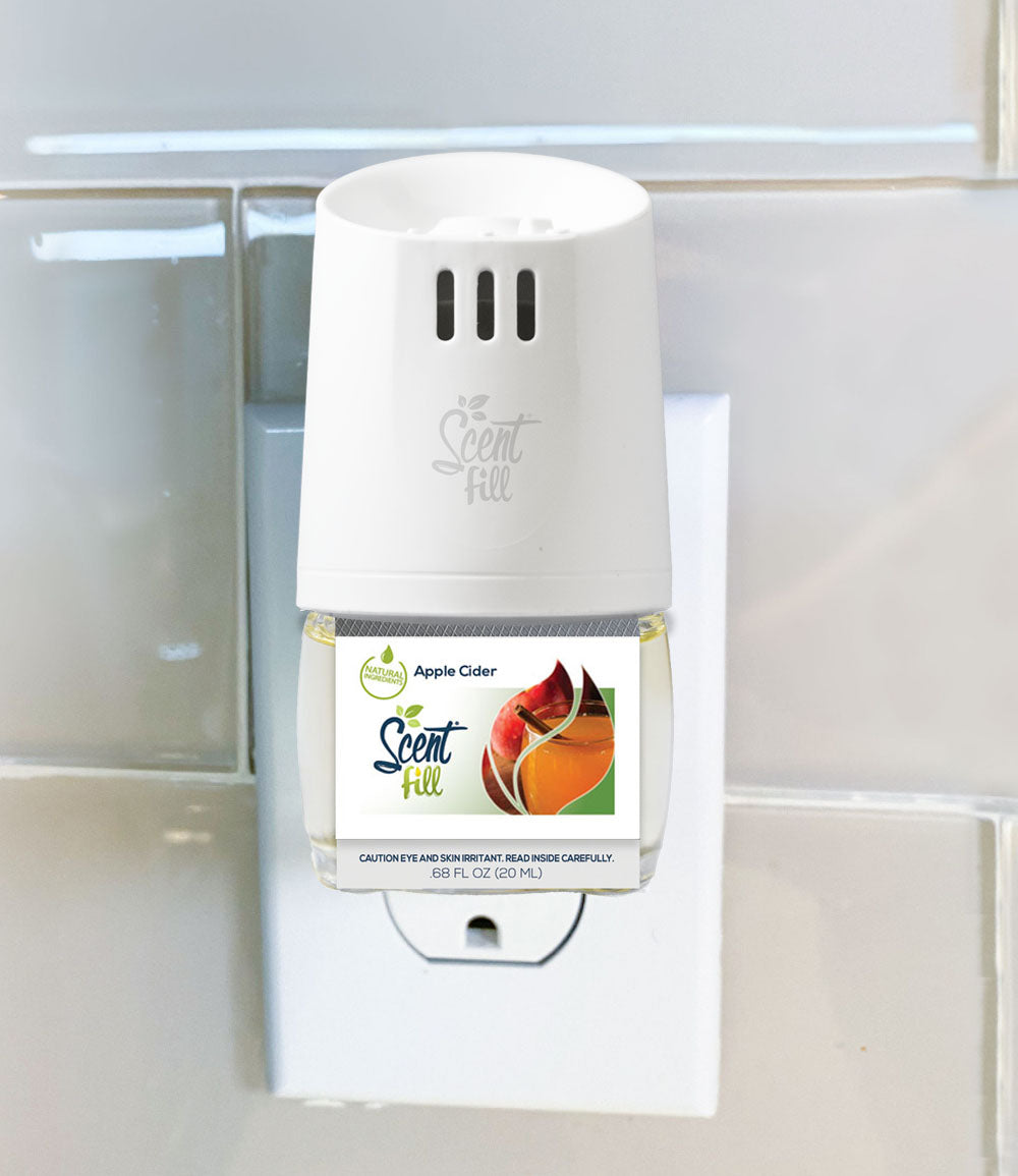 Apple Cider plug in refill plugged into outlet in warmer