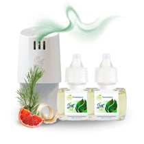 White Scent Fill plug-in diffuser releasing a soft green fragrance mist beside two Forest Essence refill bottles, with pine needles, grapefruit slices, and curled wood shavings on a light background.