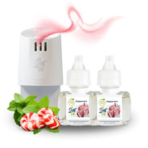 White plug-in diffuser with two Natural Peppermint refill bottles, styled with fresh mint leaves and peppermint candies, with a soft pink scent wave drifting above.