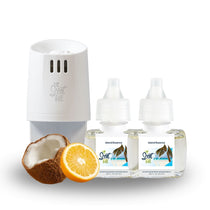 Scent Fill plug-in diffuser with two Island Essence refill bottles displayed alongside a halved coconut and sliced orange on a clean white background.