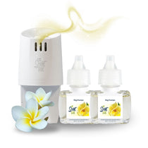 Scent Fill plug-in diffuser with two Nag Champa fragrance refill bottles on a white background, paired with white-and-yellow plumeria flowers, with a soft golden scent trail rising above the diffuser.