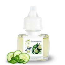 Scent Fill Cucumber & Basil plug-in refill bottle displayed with fresh cucumber slices and basil leaves on a clean white background.