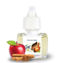 Scent Fill Cinnamon Apple plug-in air freshener refill bottle with pale liquid, white cap, red apple, cinnamon sticks, and star anise on a light background.