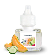 Scent Fill Cucumber Melon plug-in air freshener refill bottle (20ml) on a white background. The clear bottle with a white diffuser cap displays the Scent Fill logo on its label. Fresh cantaloupe melon wedges and sliced cucumber rounds are arranged in the foreground to the left of the bottle, representing the product's fragrance notes.