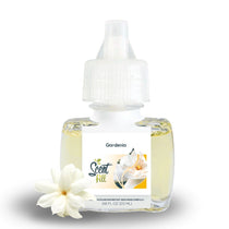 Scent Fill Gardenia fragrance refill bottle on a white background with a white gardenia flower placed in front.