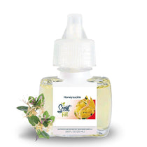 Scent Fill Honeysuckle plug-in refill bottle with honeysuckle flowers on a light background.