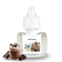 Scent Fill Hot Cocoa plug-in air freshener refill bottle with pale liquid, white cap with blue indicator dot, and a mug of hot cocoa with chocolate pieces in front on a light background.