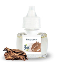 Scent Fill Mahogany & Teak plug-in air freshener refill bottle with pale liquid, white cap with blue indicator dot, and a piece of textured wood on a light background.