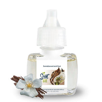 Scent Fill Sandalwood and Oud plug-in refill bottle displayed with wood pieces and a white flower on a clean white background.