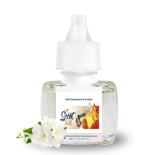 Scent Fill Soft Cashmere & Amber fragrance refill bottle on a white background with delicate white blossoms placed in front.