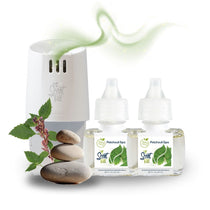 Scent Fill plug-in diffuser with two Patchouli Spa fragrance refill bottles, stacked spa stones, and green botanical sprigs, with a soft green scent trail above the diffuser.