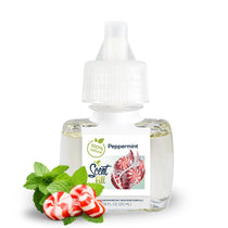 Natural Peppermint plug-in refill bottle displayed with fresh mint leaves and peppermint candies on a clean white background.